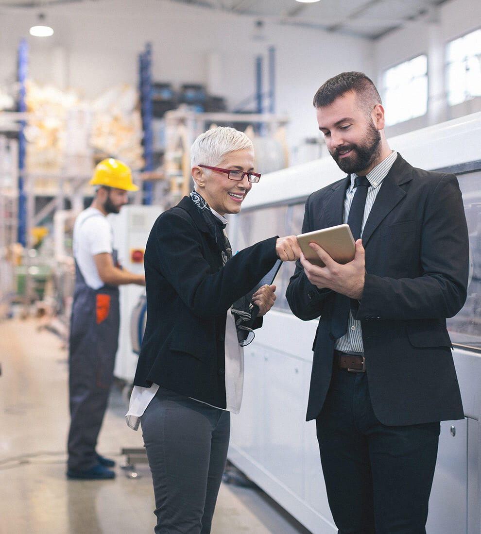 business-people-discussing-tablet-factory