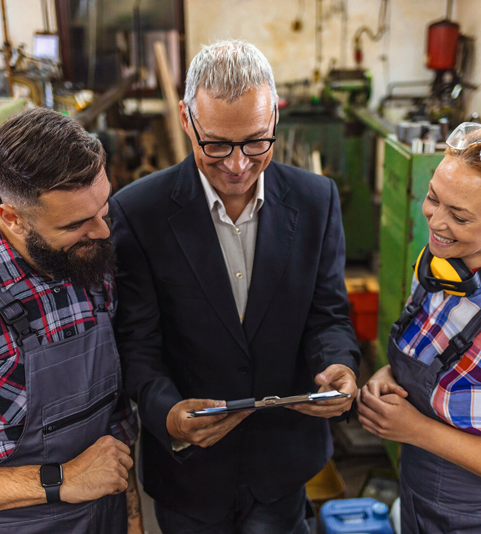 manager-and-workers-discussing-in-factory