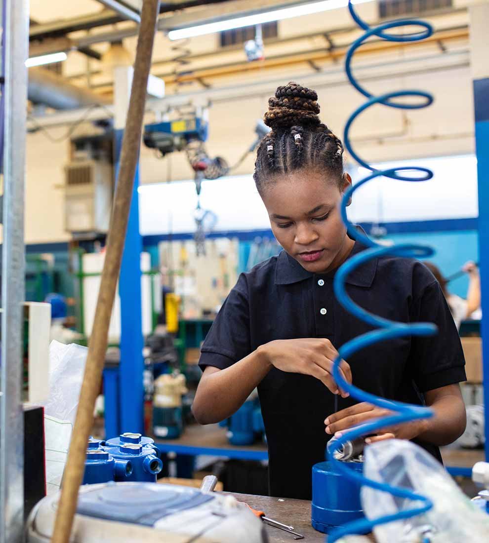 woman-assembling-parts-in-factory