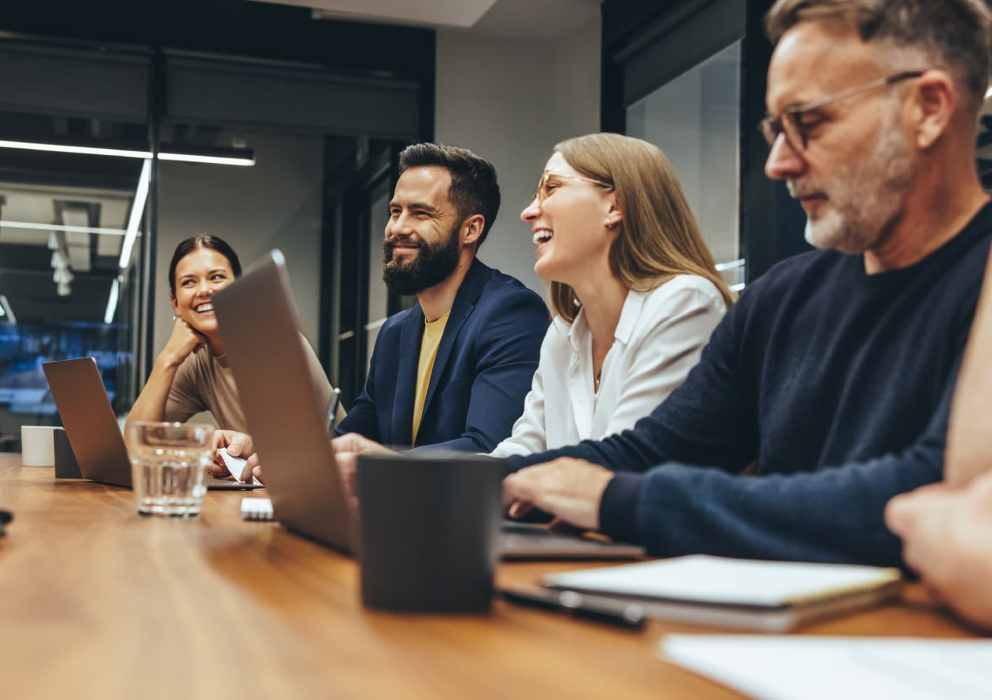 employees smiling in meeting