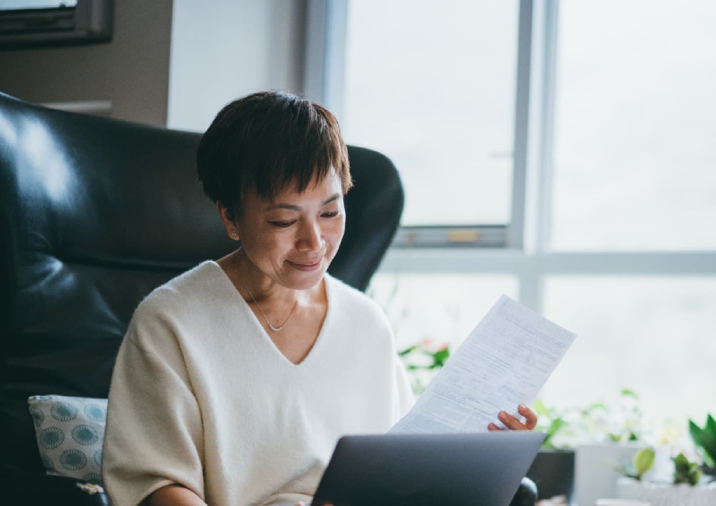 older-woman-reading-papers