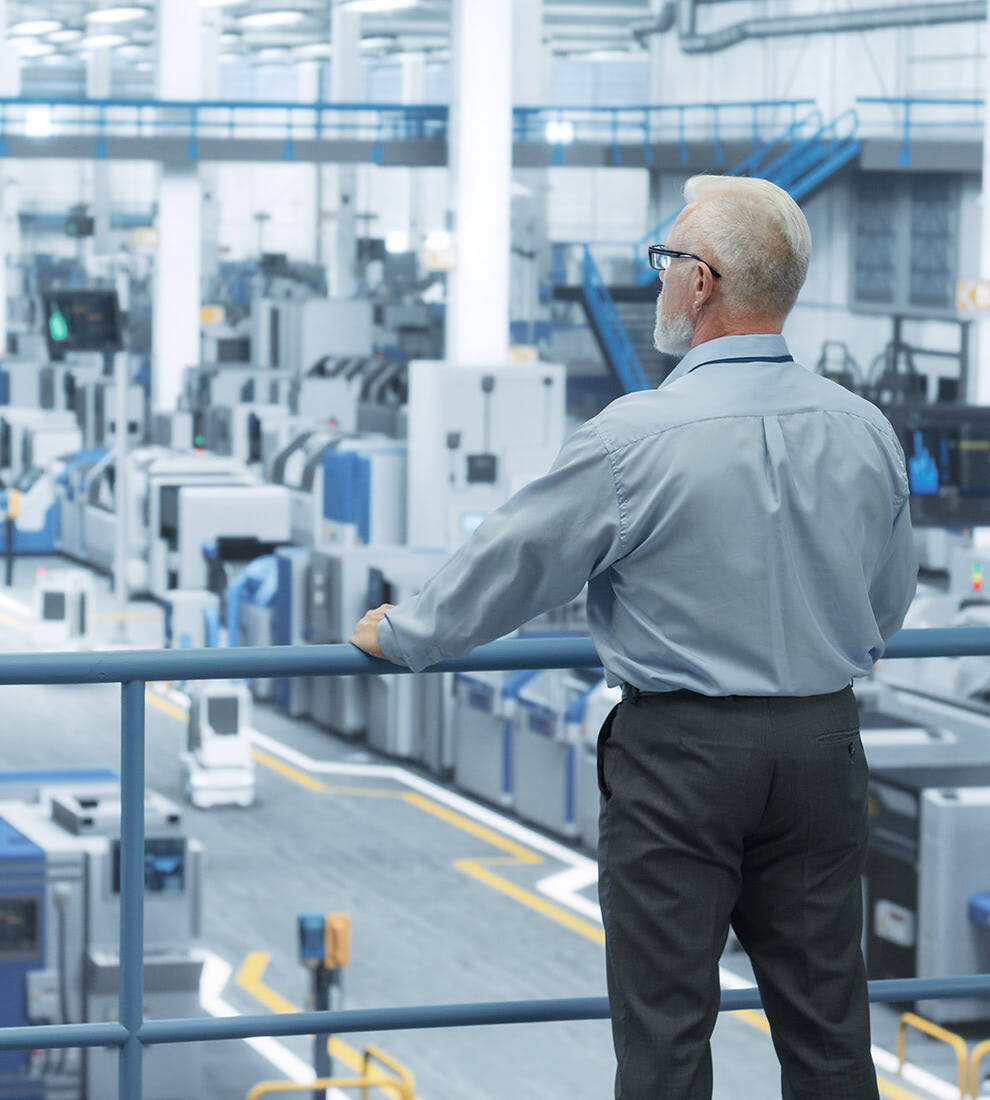 engineer-observing-smart-factory-floor