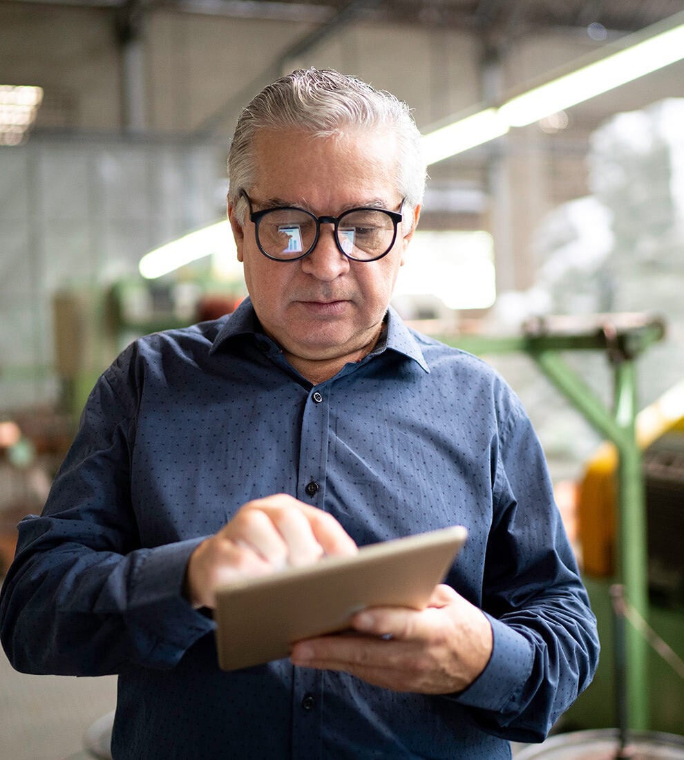 man-using-tablet-industrial-setting