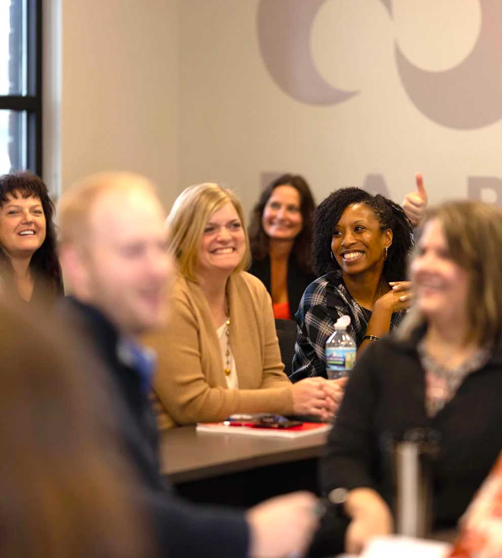 esop-team-in-conference-room-smiling